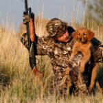 boy_with_hunting_dog